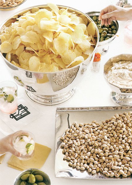 Chips and dips in silver bowls. (via Martha Stewart Living)