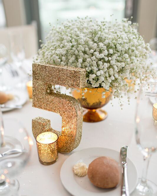 Birch Wood Centerpieces with Hydrangeas and Greenery and Wood Slab Table  Numbers