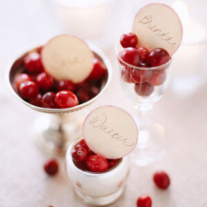 cranberries in silver bowls and glass placecards