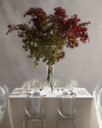 fall wedding thanksgiving centerpieces idea square table with glass vase holding fall color maple leaf branches