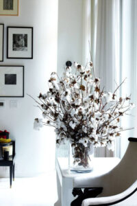 cotton boll branches in a clear vase