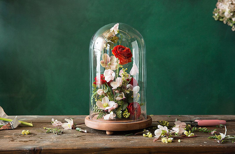 silk wedding flowers buying guide centerpiece idea with silk flowers in a cloche