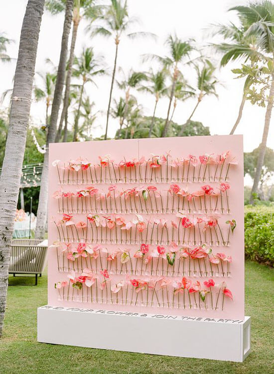 pink flower wall display of calligraphed pink anthurium flowers