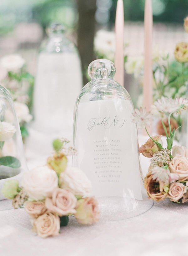 glass cloche table numbers with smaller flower bouquets