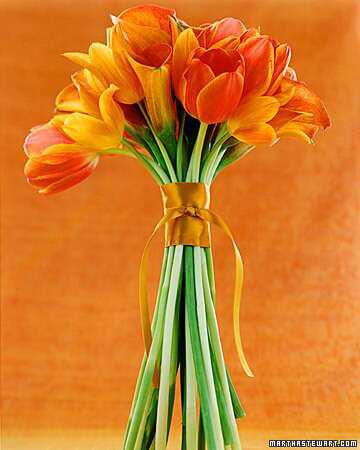 bridal bouquet of orange princess tulips tied with antique gold satin ribbon for rust married wedding theme