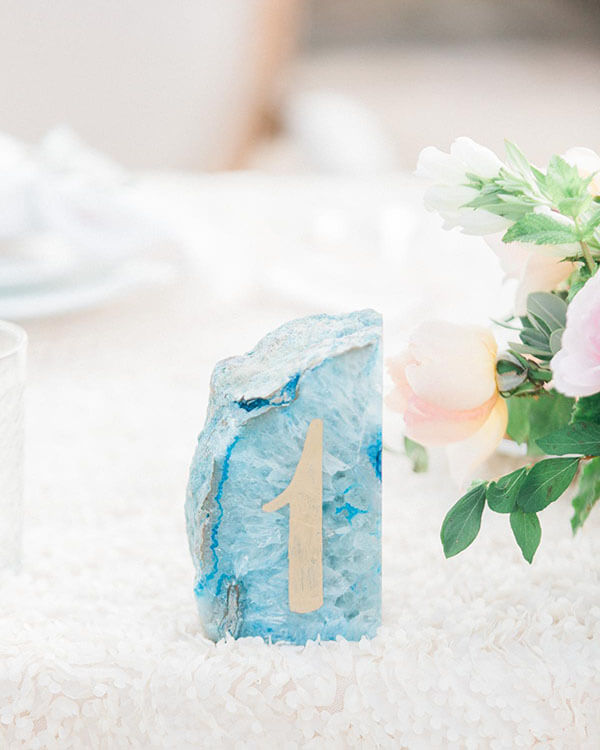 calligraphed blue geode as wedding reception table number